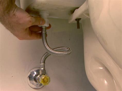 toilet tank hose leaking|How to Repair a Leaking Toilet Supply Line (Step by。